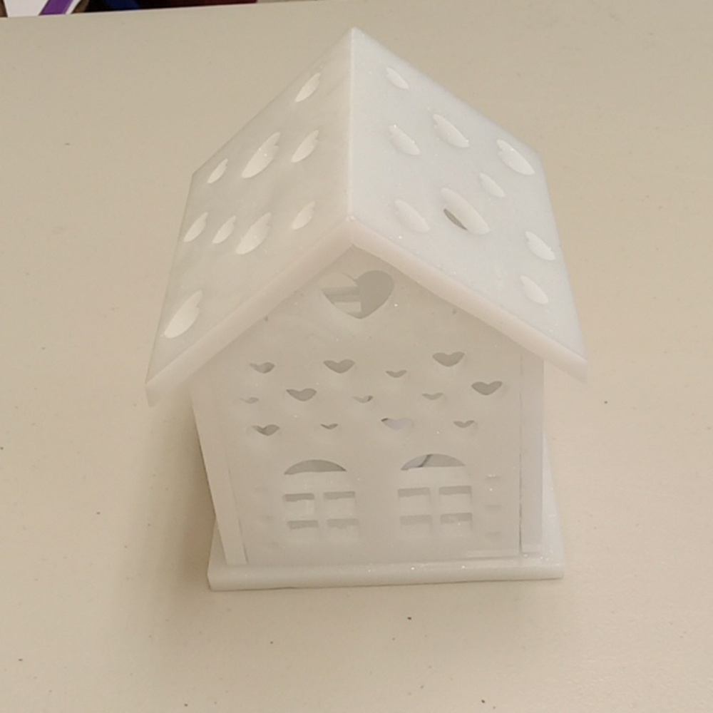 Handcrafted resin gingerbread house candle holder